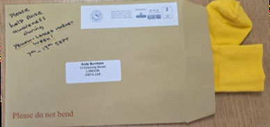 Package containing yellow socks